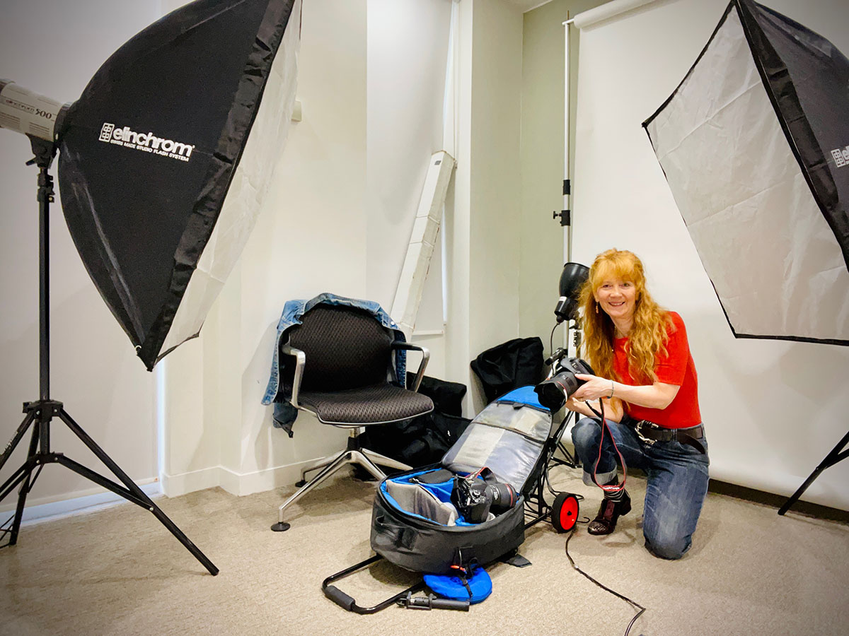 Jacky Chapman on a headshot shoot for Colliers International, London, UK 2022, using a delayed shutter.